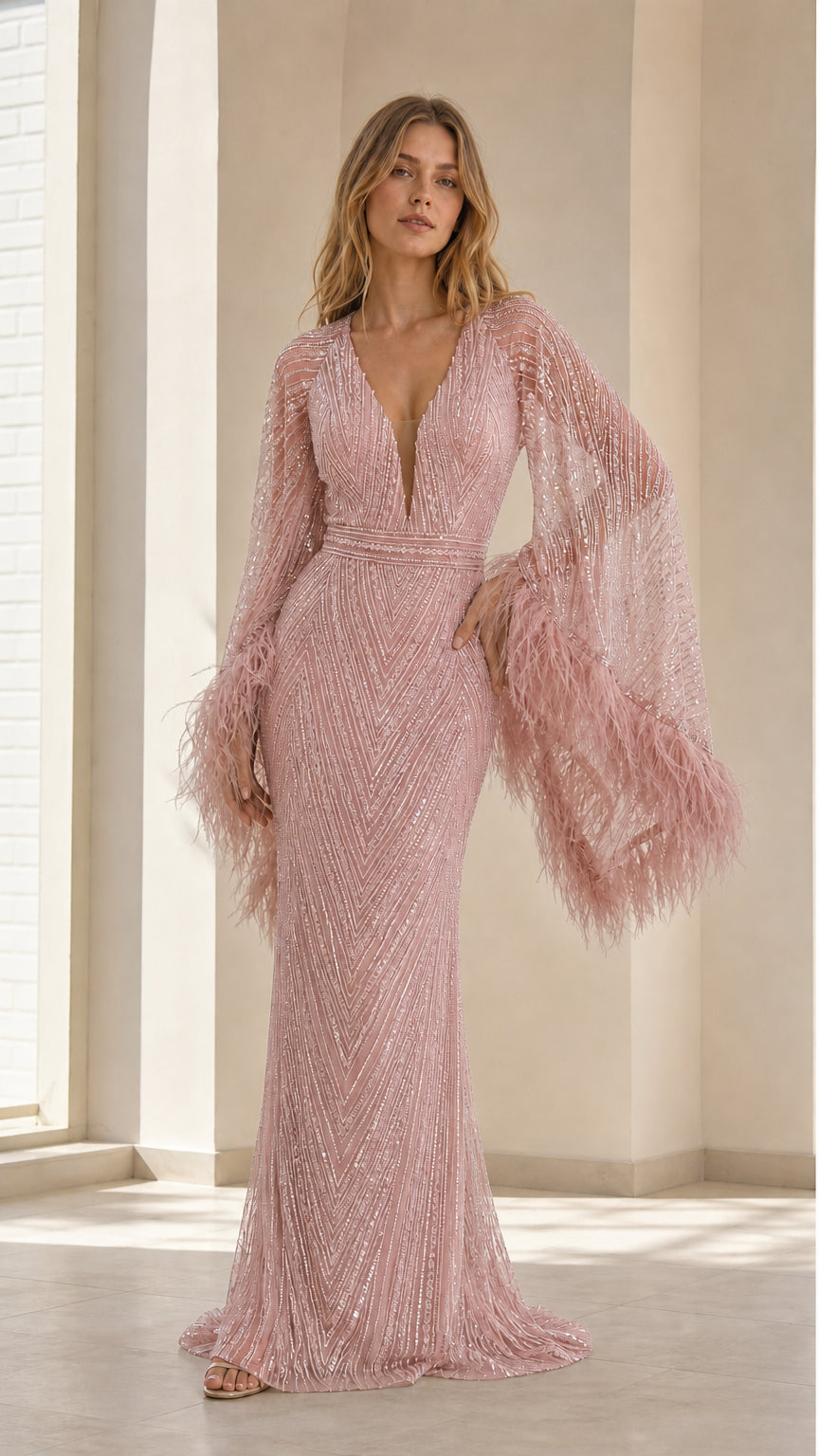 Front view of model wearing blush pink sequin evening dress with matching feather cuffs
