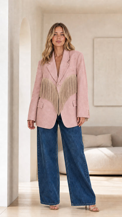 Model wearing Dusty Pink fringe trimmed blazer with wide-leg denim pants