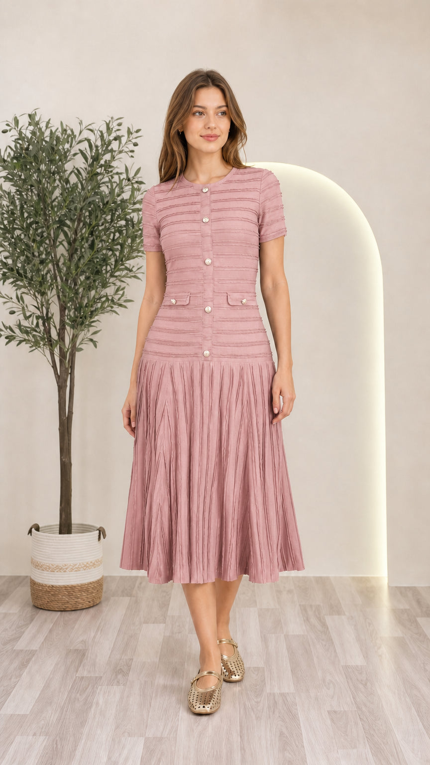 Model wearing dusty pink short sleeve pleated knit midi dress