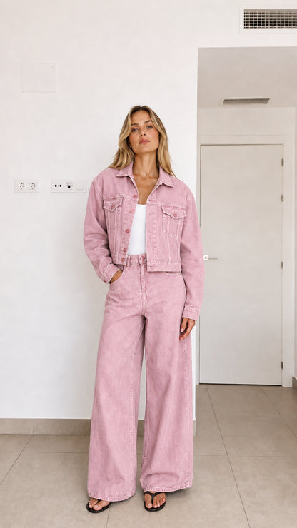 Woman wearing dusty pink 2-piece cropped denim jacket and wide-leg jeans set