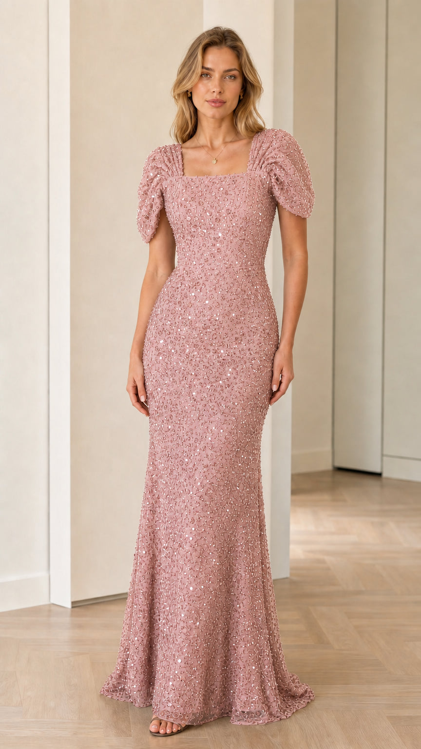 Front view of model wearing dusty pink sequin puff sleeve maxi dress