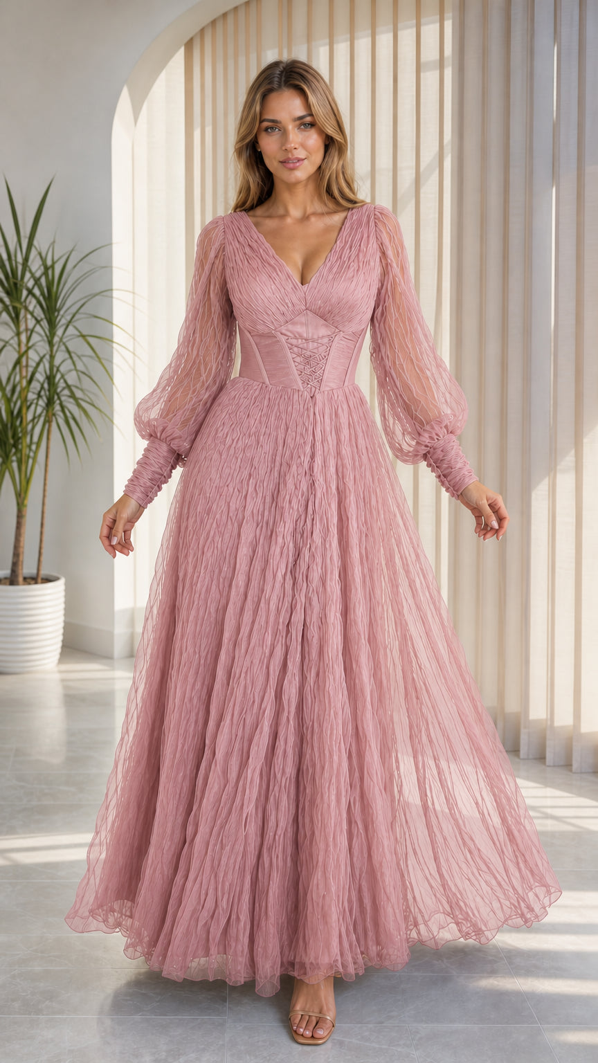 Front view of model wearing dusty rose pink tulle evening dress with cinched waist