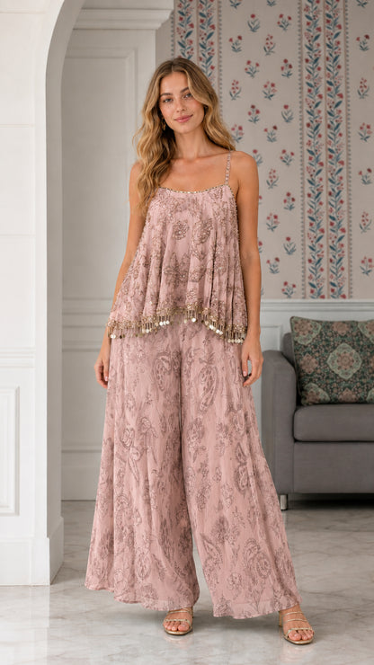 Model wearing dusty pink embroidered two-piece cami and wide-leg pant set