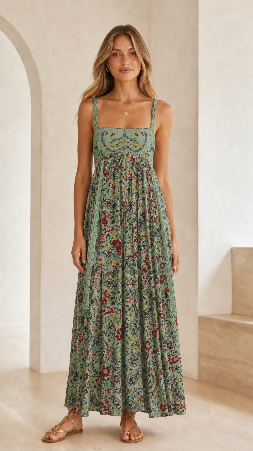Front view of model wearing sage green floral print square neck maxi dress
