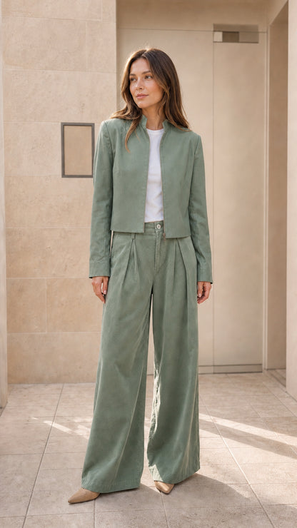 Model wearing sage green cropped zip-up jacket and matching wide trousers