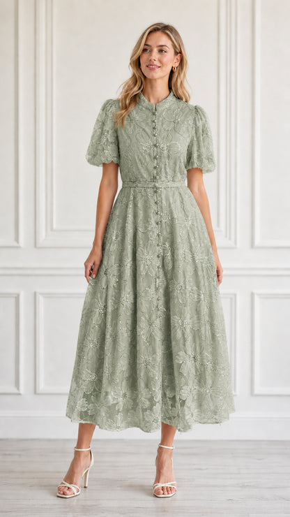 Front view of model wearing sage green floral embroidered midi dress