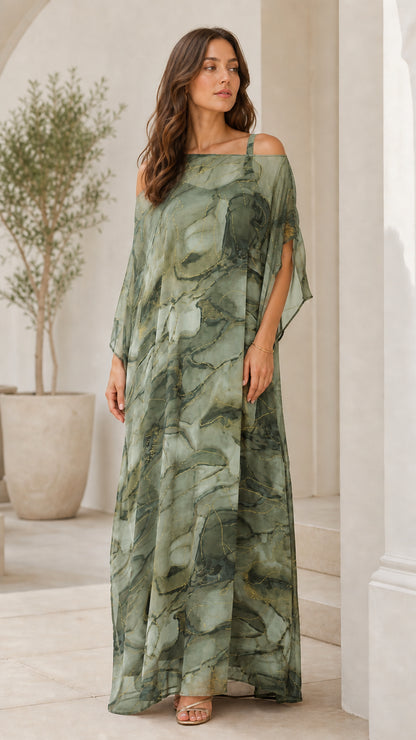 Woman wearing sage green artistic print cold-shoulder draped maxi dress