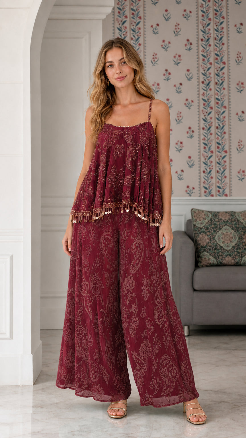 Model wearing burgundy wine sequin embroidered two-piece pant set