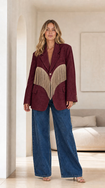 Model wearing Burgundy tailored blazer accented with beige fringe trim