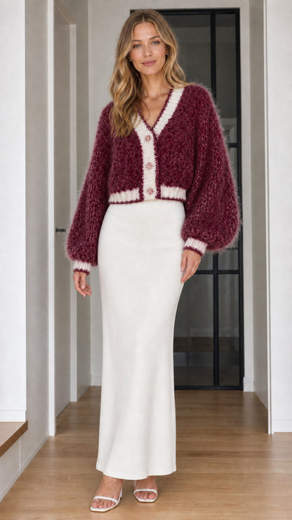 Model wearing burgundy wine fuzzy cropped button-up cardigan