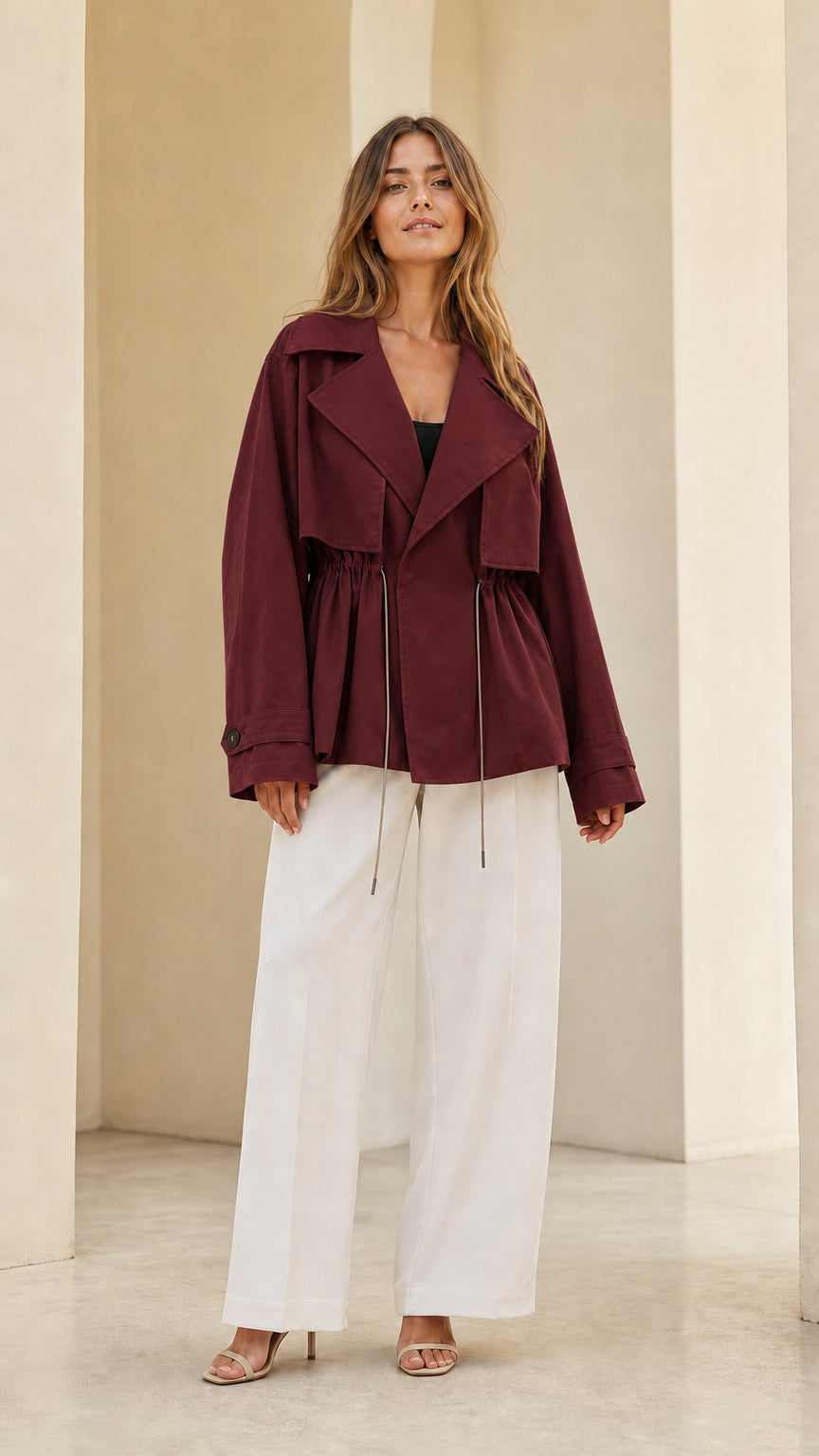 Front view of model wearing burgundy wine short trench jacket
