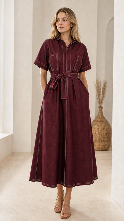 Front view of woman wearing burgundy short sleeve contrast stitch belted midi shirt dress
