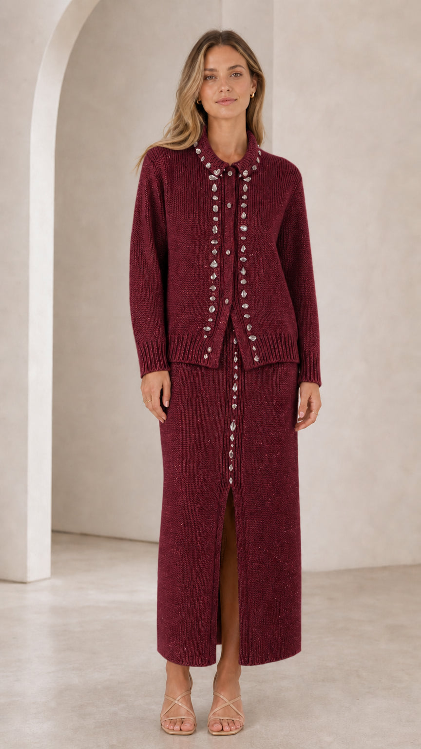 Front view of woman wearing burgundy wine rhinestone-embellished knit cardigan and maxi skirt set