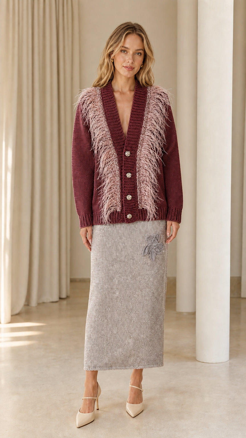 Front view of woman wearing burgundy wine feather trim cardigan sweater