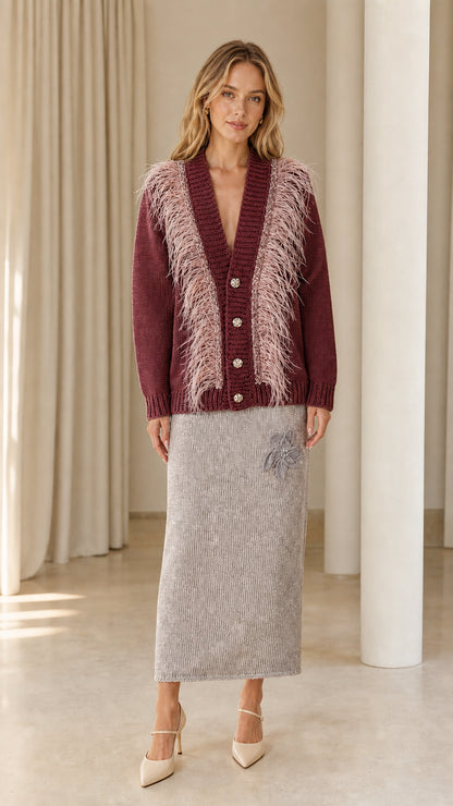 Front view of woman wearing burgundy wine feather trim cardigan sweater