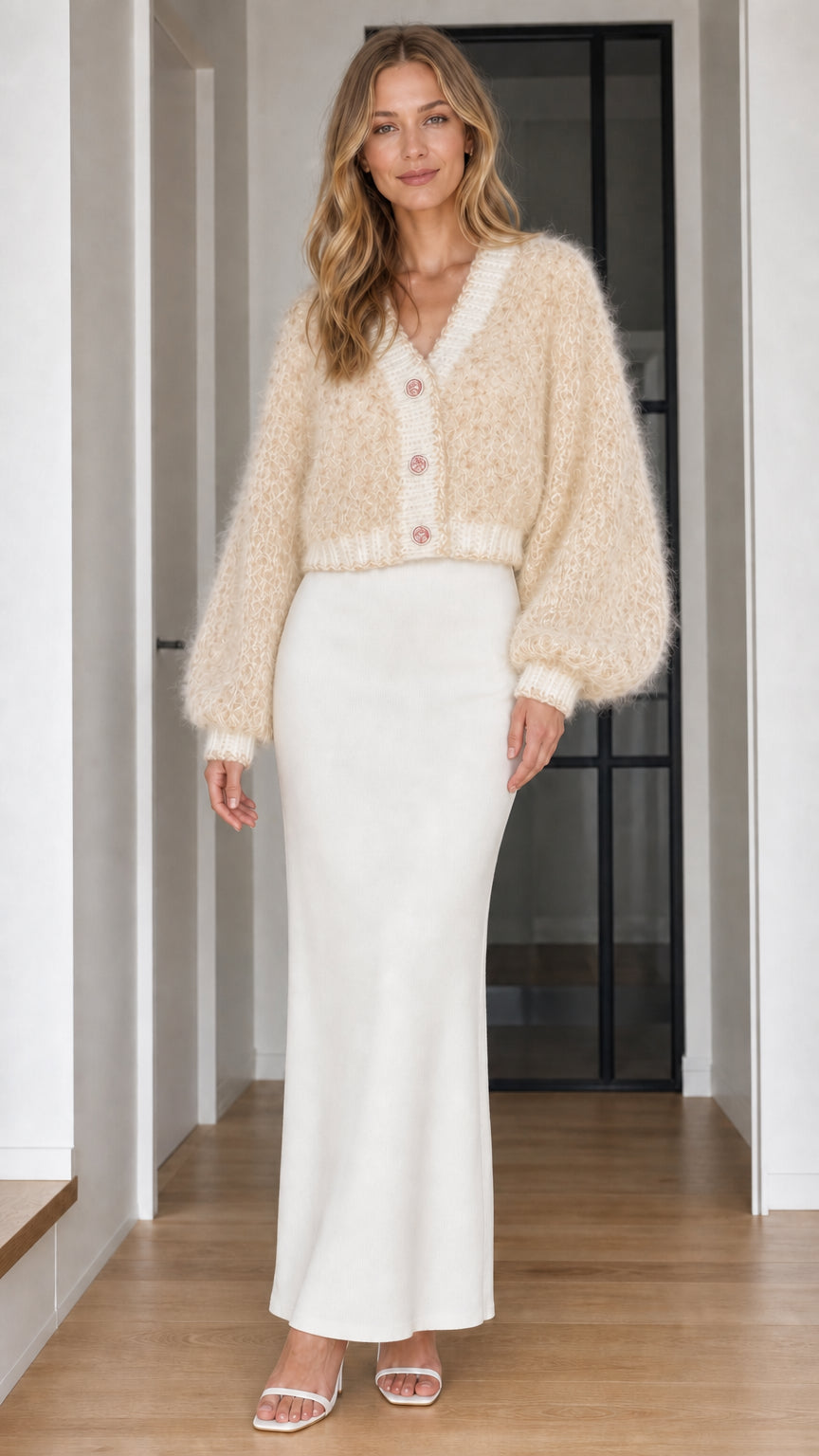 Model wearing beige cream fuzzy knit balloon sleeve cropped cardigan