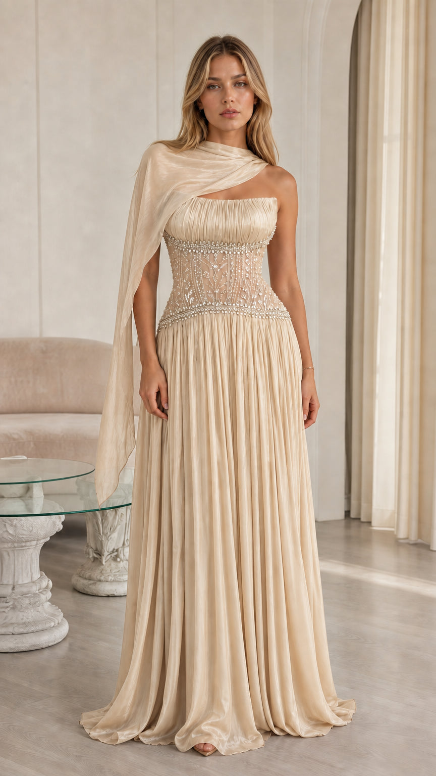 Front view of champagne beige pleated chiffon evening gown with beaded corset