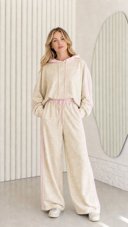 Woman wearing Oatmeal cream two-piece tracksuit set with pink contrast trim