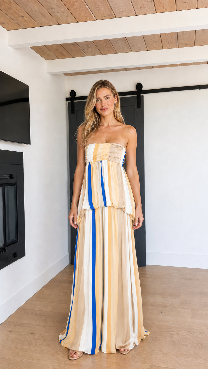 Front view of model wearing Beige Multi striped strapless maxi dress